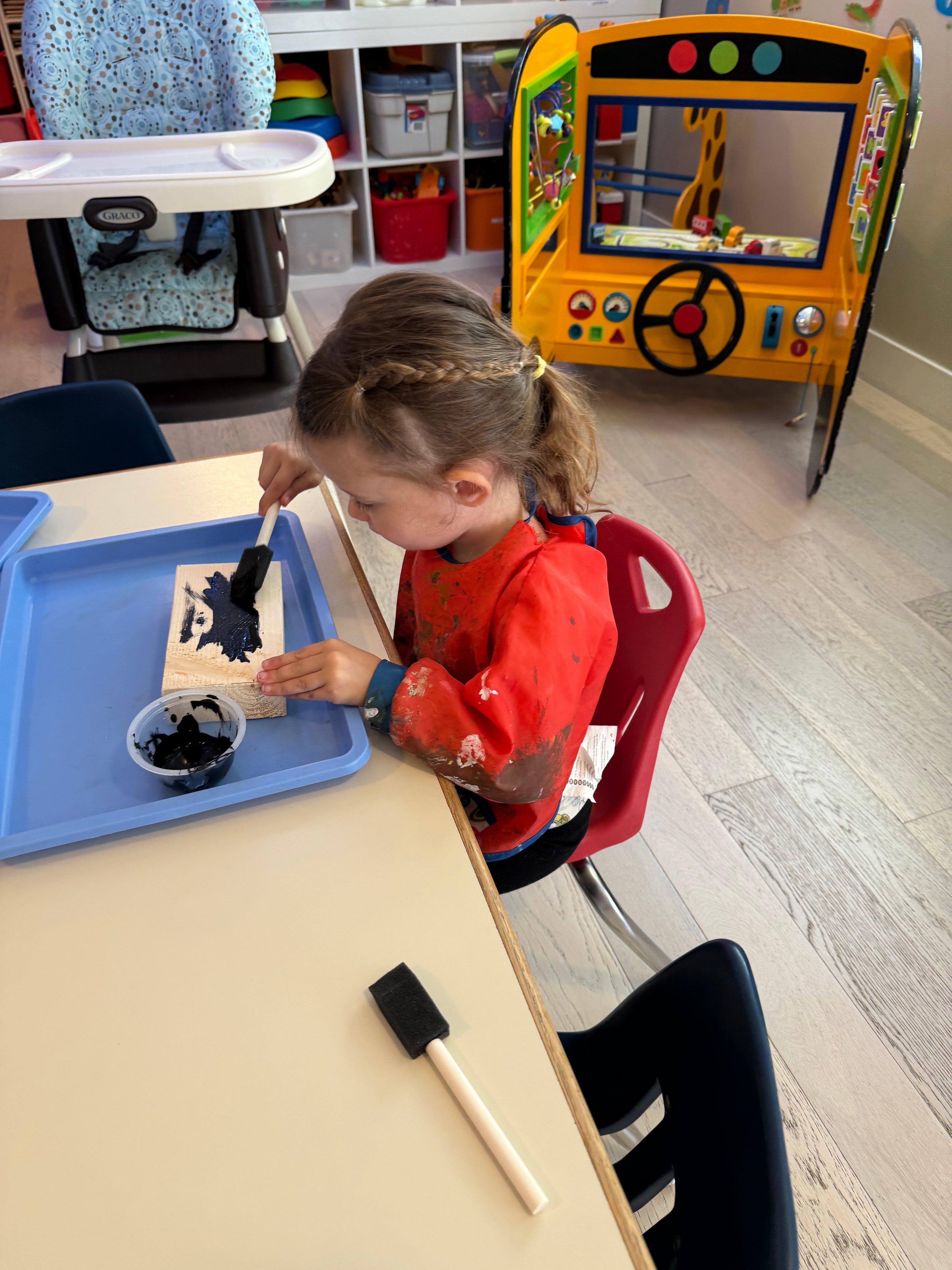 Toddler playing with educational toys at daycare