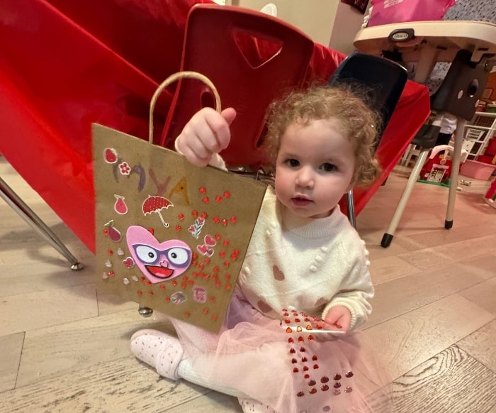Young child reading and learning at daycare